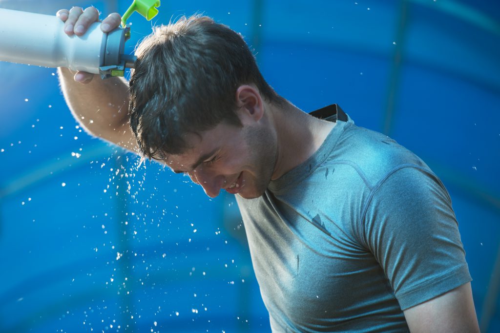 Athlete splashing pouring water head Sterling Nutrition